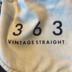 Dark blue with gold/tan stitching.